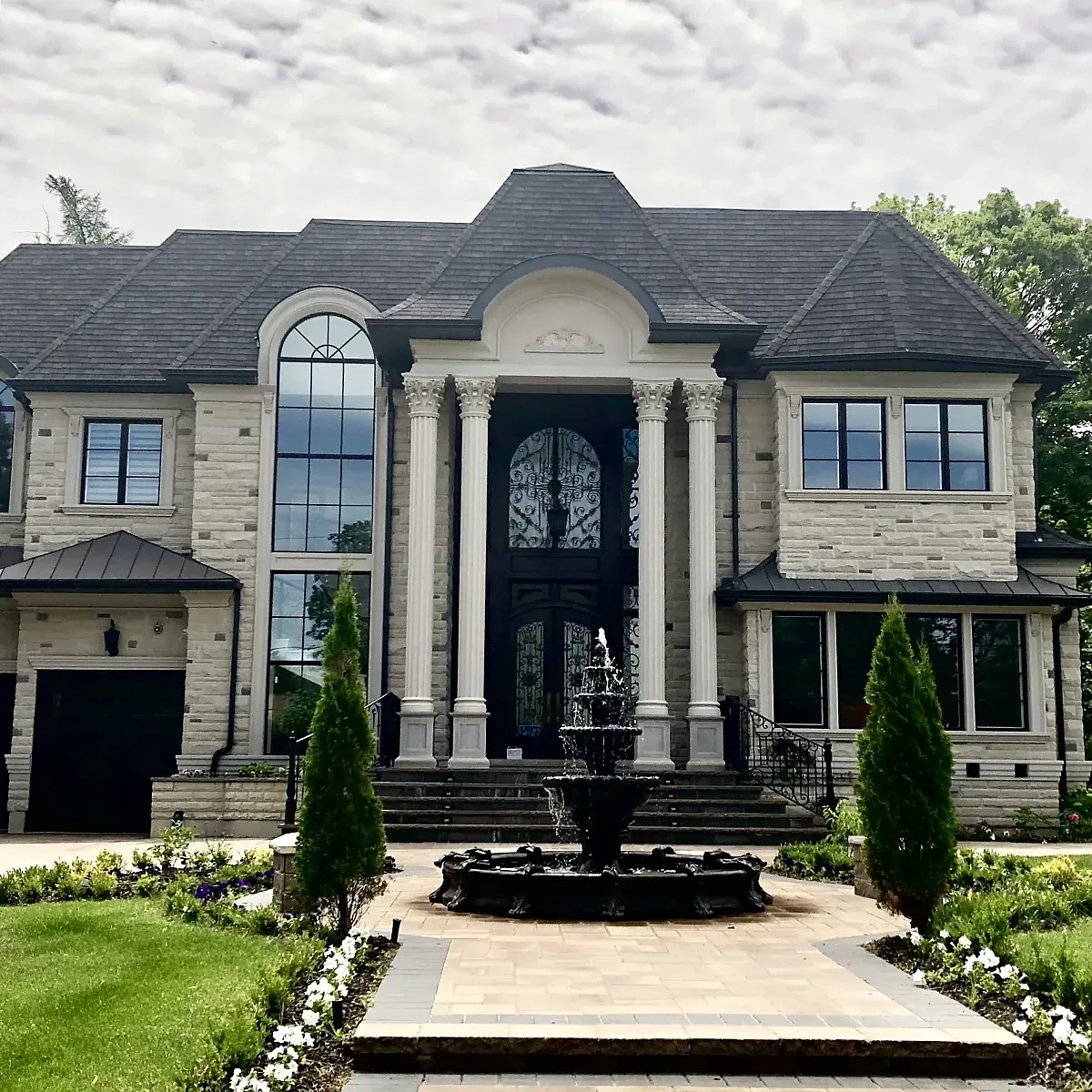Symmetrical residence with a central entrance and contrasting window surrounds